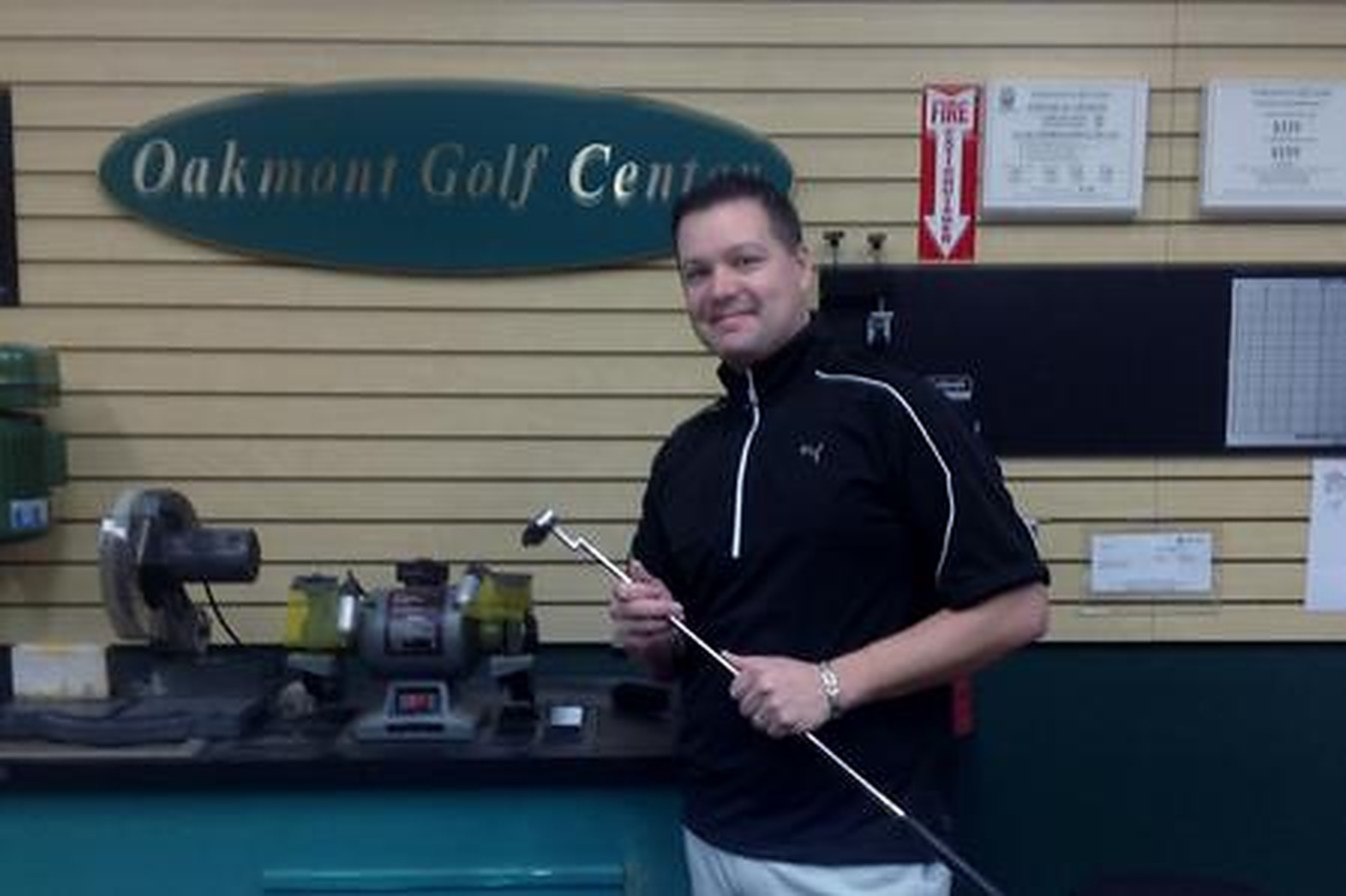 Dave Gedris, PGA Professional and owner, at the counter of Oakmont Golf Center